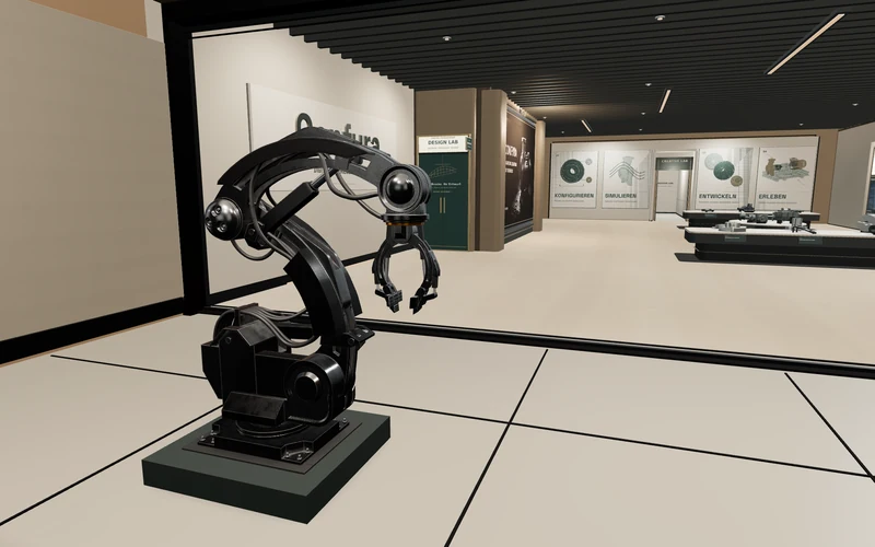 Roboterstation vor der Glaswand mit Blick in die technische Galerie des CONFYRA-Showrooms
